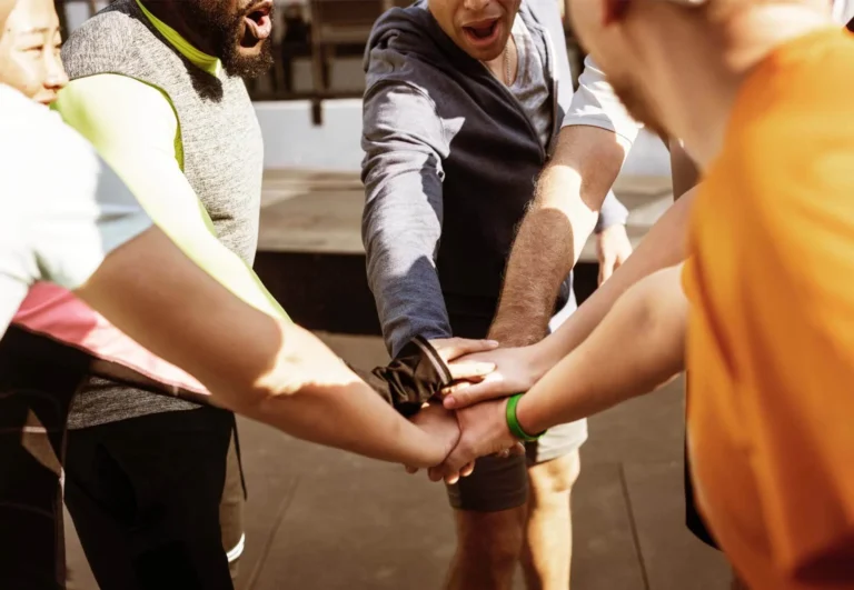 Hands joined together during a group activity